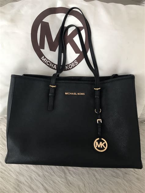 michael kors tas echtheid|Michael Kors bag logo.